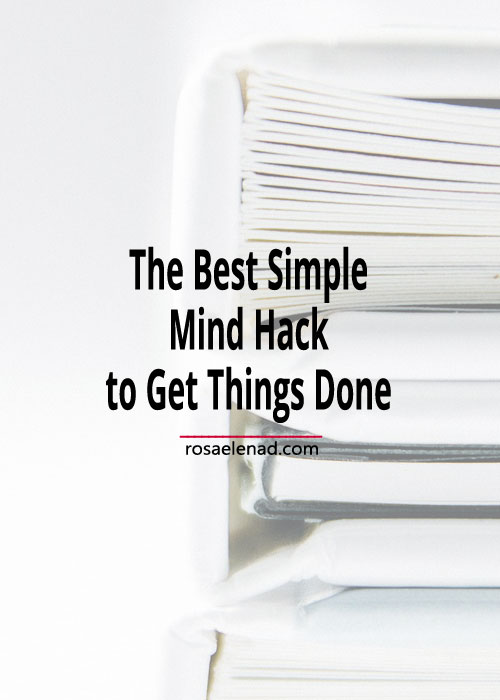 Pile of books with text overlay - The Best Simple Mind Hack to Get Things Done